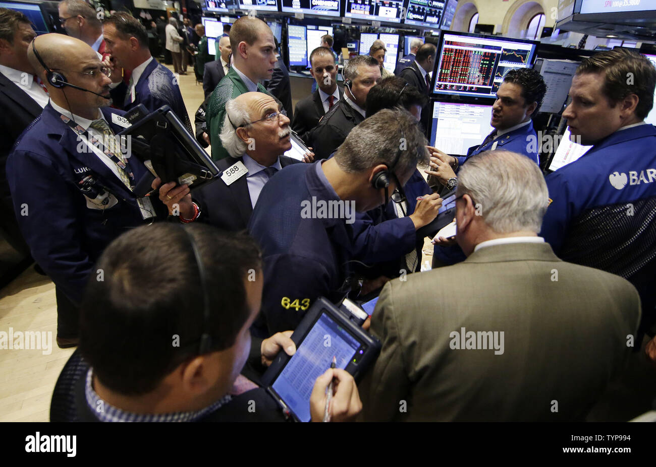 Traders Work On The Floor Of The New York Stock Exchange At The