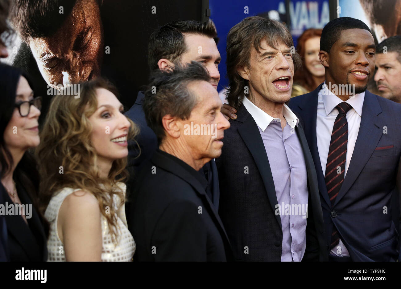 Victoria Pearman, Erica Huggins, Brian Grazer, Tate Taylor, Mick Jagger and Chadwick Boseman arrive on the red carpet at the world premiere of 'Get On Up' at the Apollo Theater in New York City on July 21, 2014. The movie is a chronicle of James Brown's rise from extreme poverty to become one of the most influential musicians in history.      UPI/John Angelillo Stock Photo