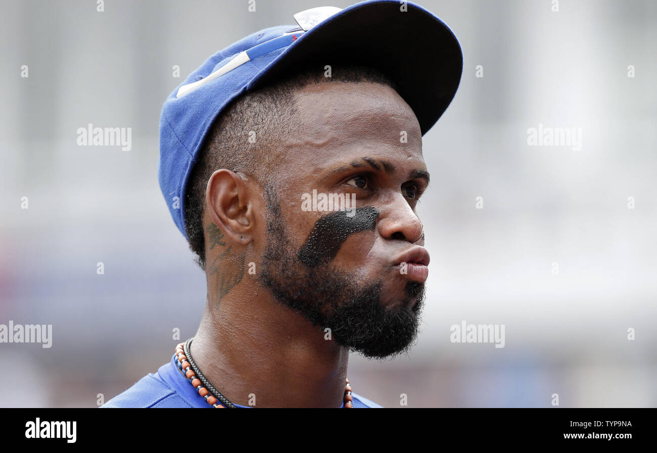 Toronto Blue Jays Jose Reyes and New York Yankees Carlos Beltran walk off  the field together in the second inning at Yankee Stadium in New York City  on on July 27, 2014., image size:1300x897