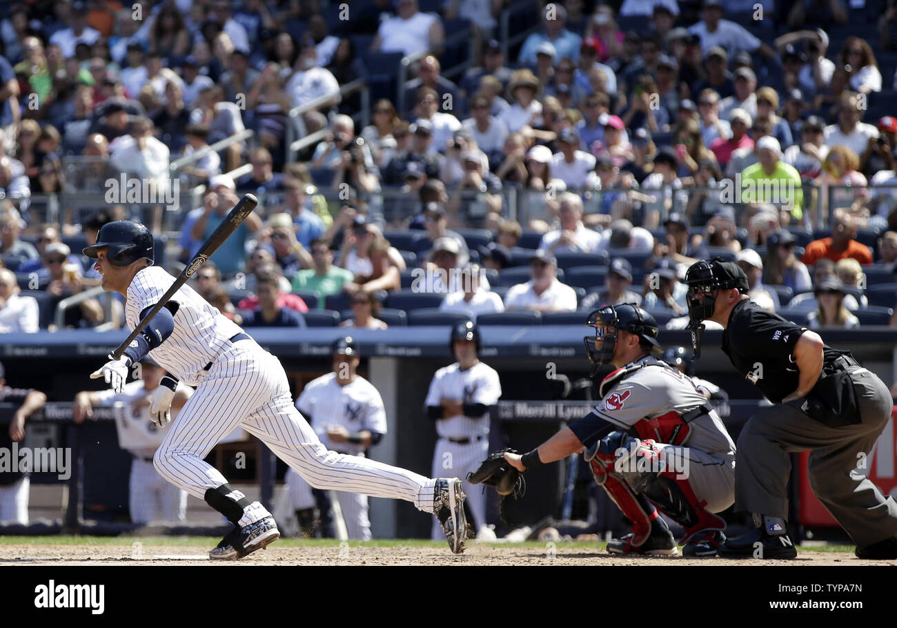 Cleveland Indians Yan Gomes and home plate umpire Jeff Kellogg watch