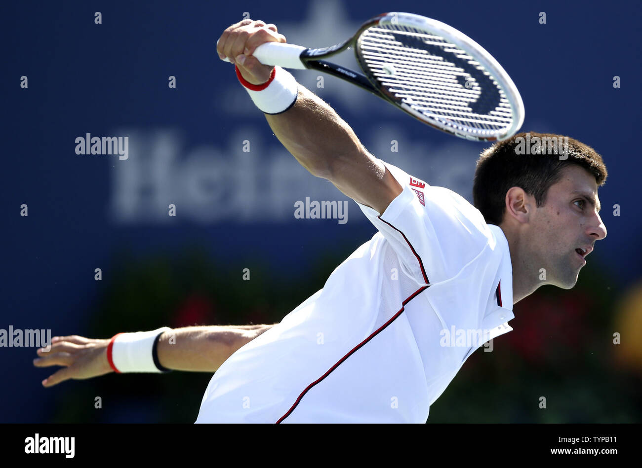 Novak Djokovic of Serbia hits a backhand to Paul-Henri Mathieu of France in  their second round match at the US Open Tennis Championships at the USTA  Billie Jean King National Tennis Center