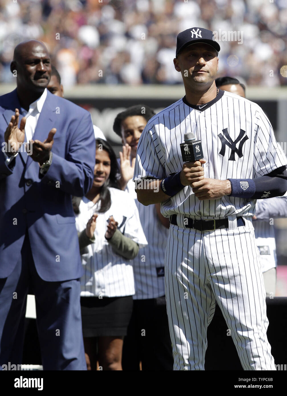 Michael Jordan watches New York Yankees Derek Jeter speak at Derek Jeter Day ceremonies when the New York Yankees play the Kansas City Royals at Yankee Stadium in New York City on