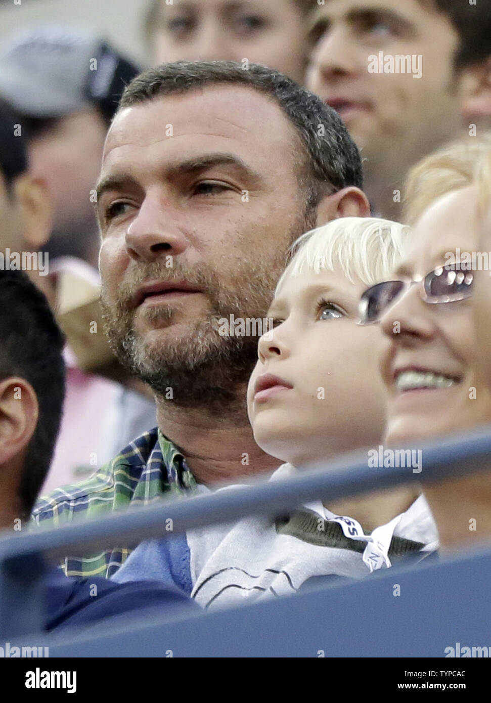 Liev Schreiber and his son Samuel Schreiber watch Kei Nishikori of Japan play Marin Cilic of Croatia in the Men's Final in Arthur Ashe Stadium at the US Open Tennis Championships at the USTA Billie Jean King National Tennis Center in New York City on September 8, 2014. Cilic defeated Nishikori 6-3, 6-3, 6-3 to win his first US Open Championship.       UPI/John Angelillo Stock Photo