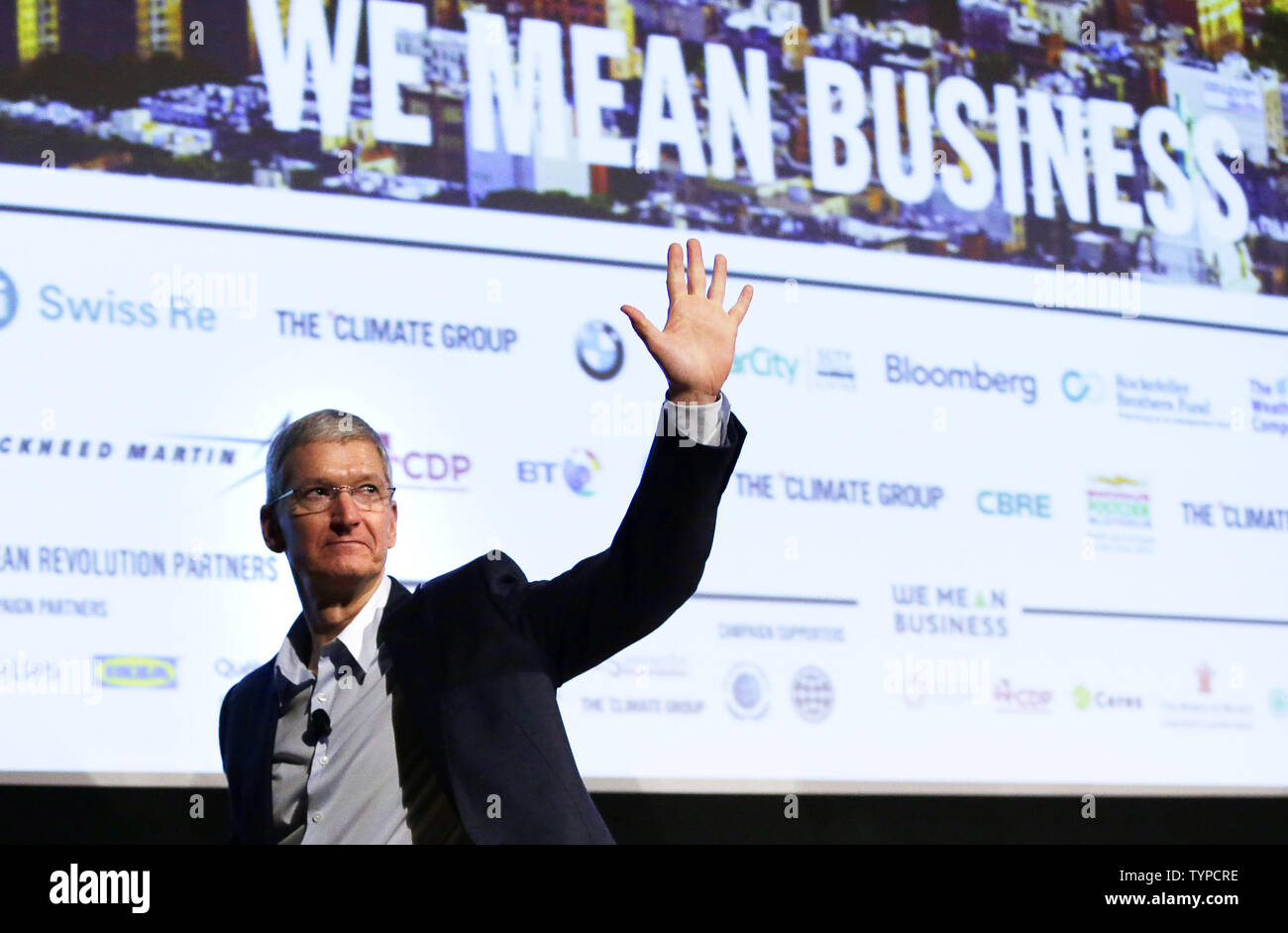 Apple CEO Tim Cook waves after speaking at a 'Climate Week NYC' event at the Morgan Library and Museum in New York City on September 22, 2014. 'Climate Week NYC' events are scheduled to continue through Sunday, September 28 and coincide with the U.N.'s 2014 Climate Summit.     UPI/John Angelillo Stock Photo
