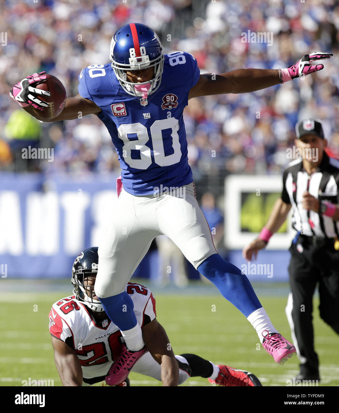 Seattle Seahawks Kam Chancellor and New York Giants Victor Cruz leap for a  pass from Eli Manning before Cruz makes a one handed catch for a 68 yard  touchdown in the fourth