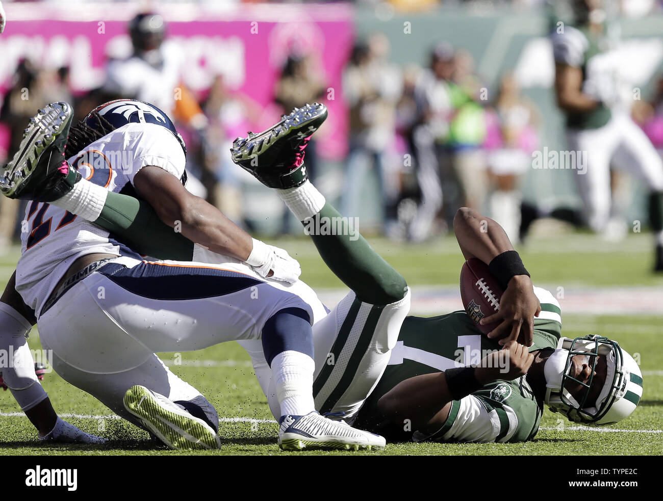 Denver Broncos Bradley Roby sacks New York Jets Geno Smith for a 3 yard loss in the third quarter in week 6 of the NFL season at MetLife Stadium in East Rutherford, New Jersey on October 12, 2014. The Broncos defeated the Jets 31-17.     UPI /John Angelillo Stock Photo