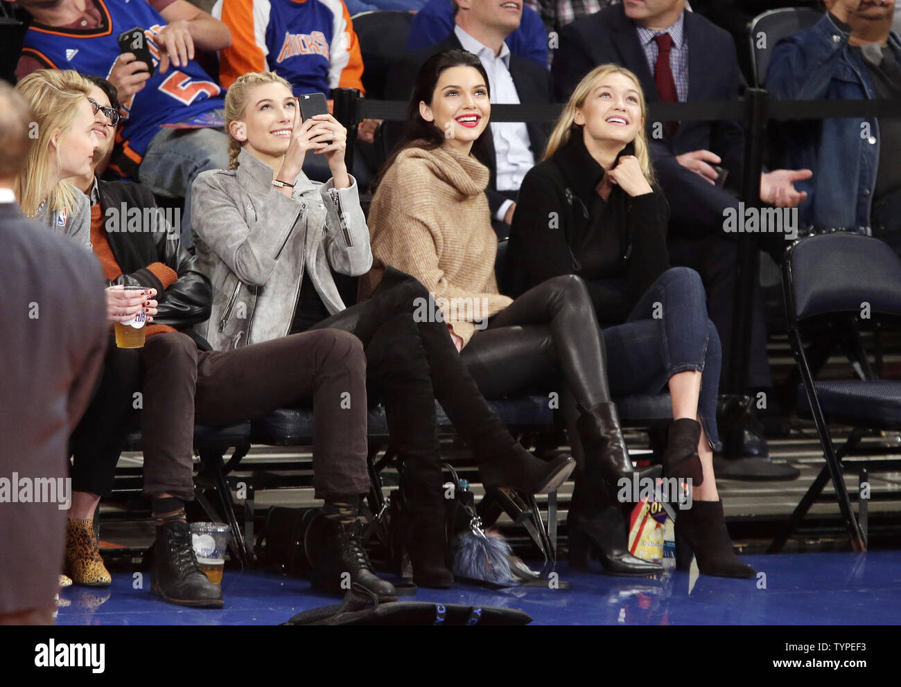 Hailey Baldwin Kendall Jenner and Gigi Hadid watch the New York Knicks play the Washington Wizards in a pre season game at Madison Square Garden in New York City on October 22