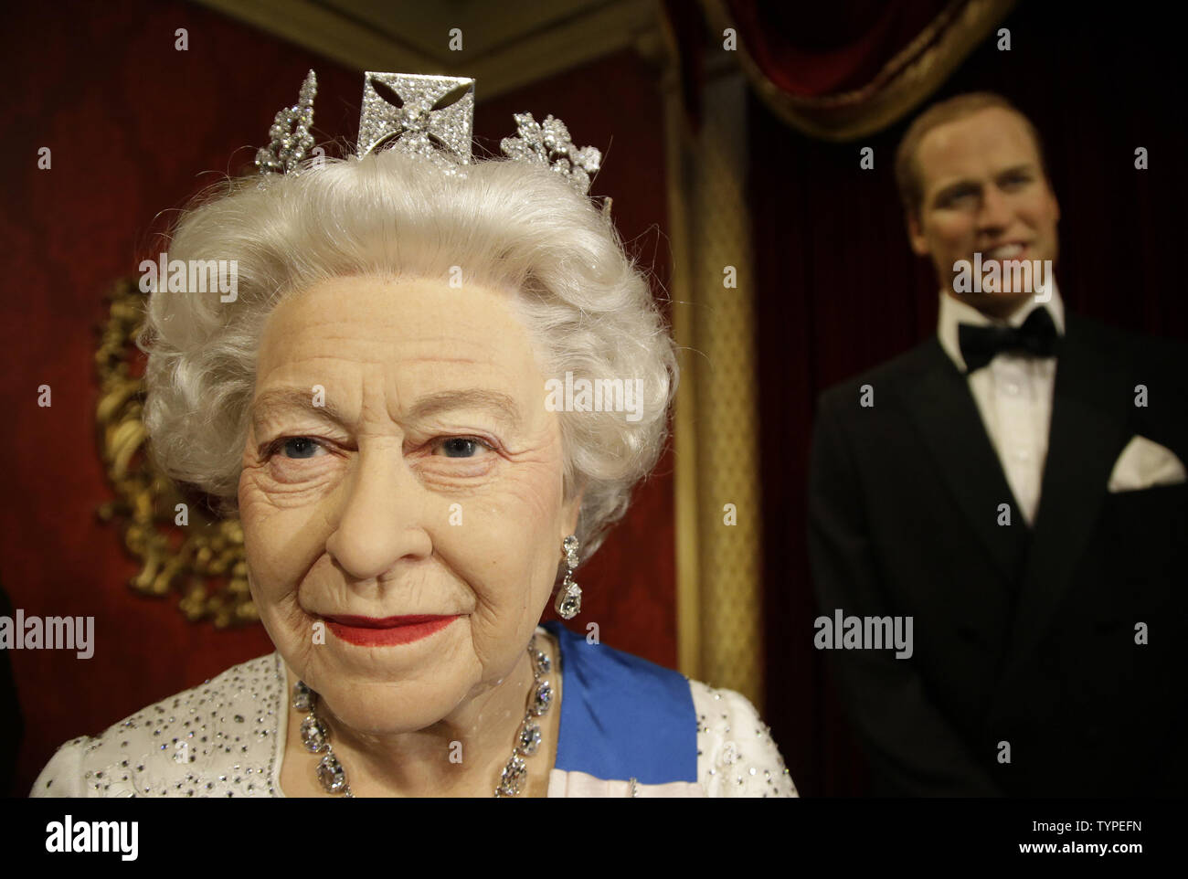 Wax figures of Queen Elizabeth and Prince William seen here along with Prince Harry and Duchess