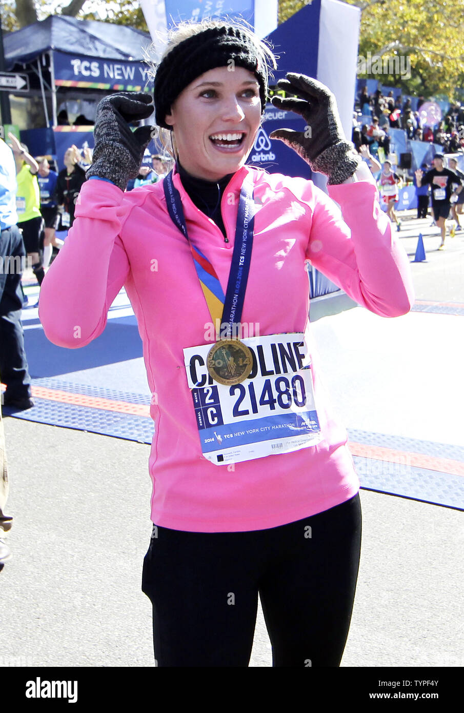 Tennis star Caroline Wozniacki reacts at the finish line after completing  the NYRR TCS New York City Marathon in New York City on November 2, 2014.  50,000 runners from the Big Apple