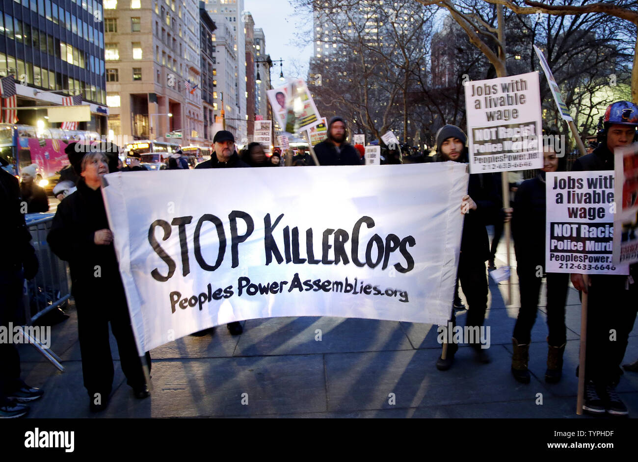 Protesters Hold Signs Near City Hall In Lower Manhattan Over 2