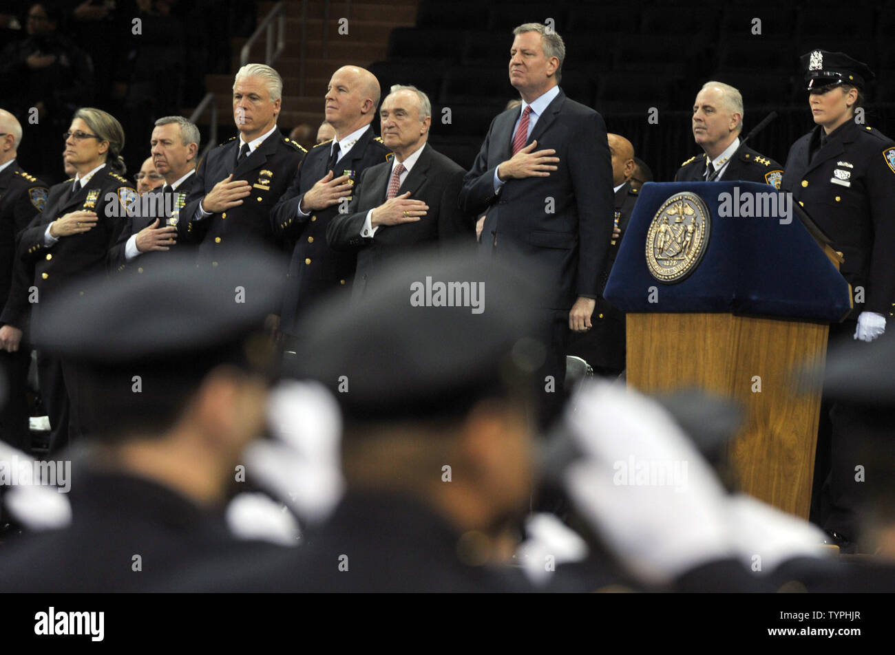 New York City Mayor Bill de Blasio and New York Police Commissioner William Bratton stand on stage during the New York City Police Academy's graduation ceremony at Madison Square Garden in New York City on December 27, 2014. The relationship between de Blasio and the NYPD has been poor in the past weeks due to the alleged lack of support for the police from de Blasio.      UPI/Dennis Van Tine Stock Photo