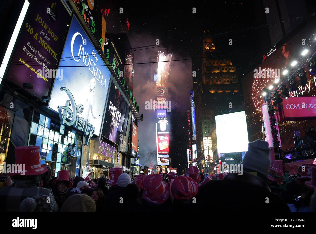 https://c8.alamy.com/comp/TYPHMX/people-watch-as-fireworks-go-off-in-times-square-after-midnight-on-new-years-eve-in-new-york-city-on-january-1-2015-approximately-one-million-revelers-stood-in-times-square-to-watch-the-ball-drop-and-bring-in-the-new-year-on-the-first-day-of-2015-upijohn-angelillo-TYPHMX.jpg