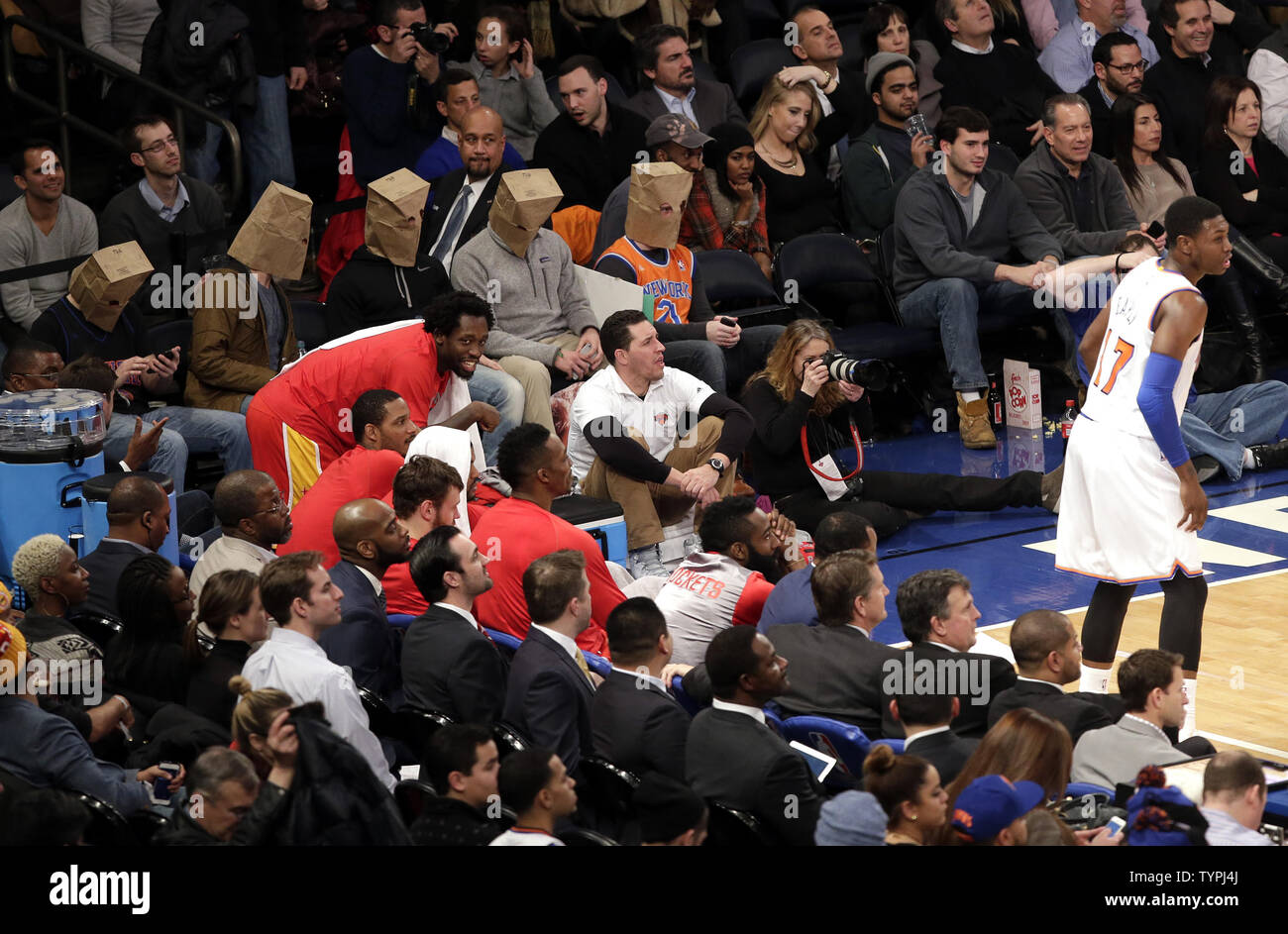 Five fans wear paper bags on their heads in the 4th quarter when the New  York Knicks play the Houston Rockets at Madison Square Garden in New York  City on January 8,
