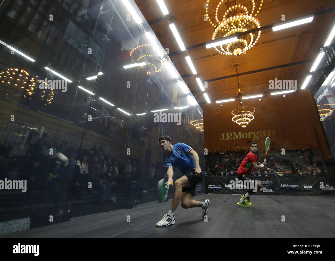 Chris Simpson of England hits a forehand in his match against Cesar Salazar of Mexico at JPMorgan Chase & Co.'s 18th annual  "Tournament of Champions" Professional Squash Tournament in Grand Central Terminal in New York City on January 16, 2015. The annual tournament is scheduled to continue through January 23rd.       Photo by John Angelillo/UPI Stock Photo