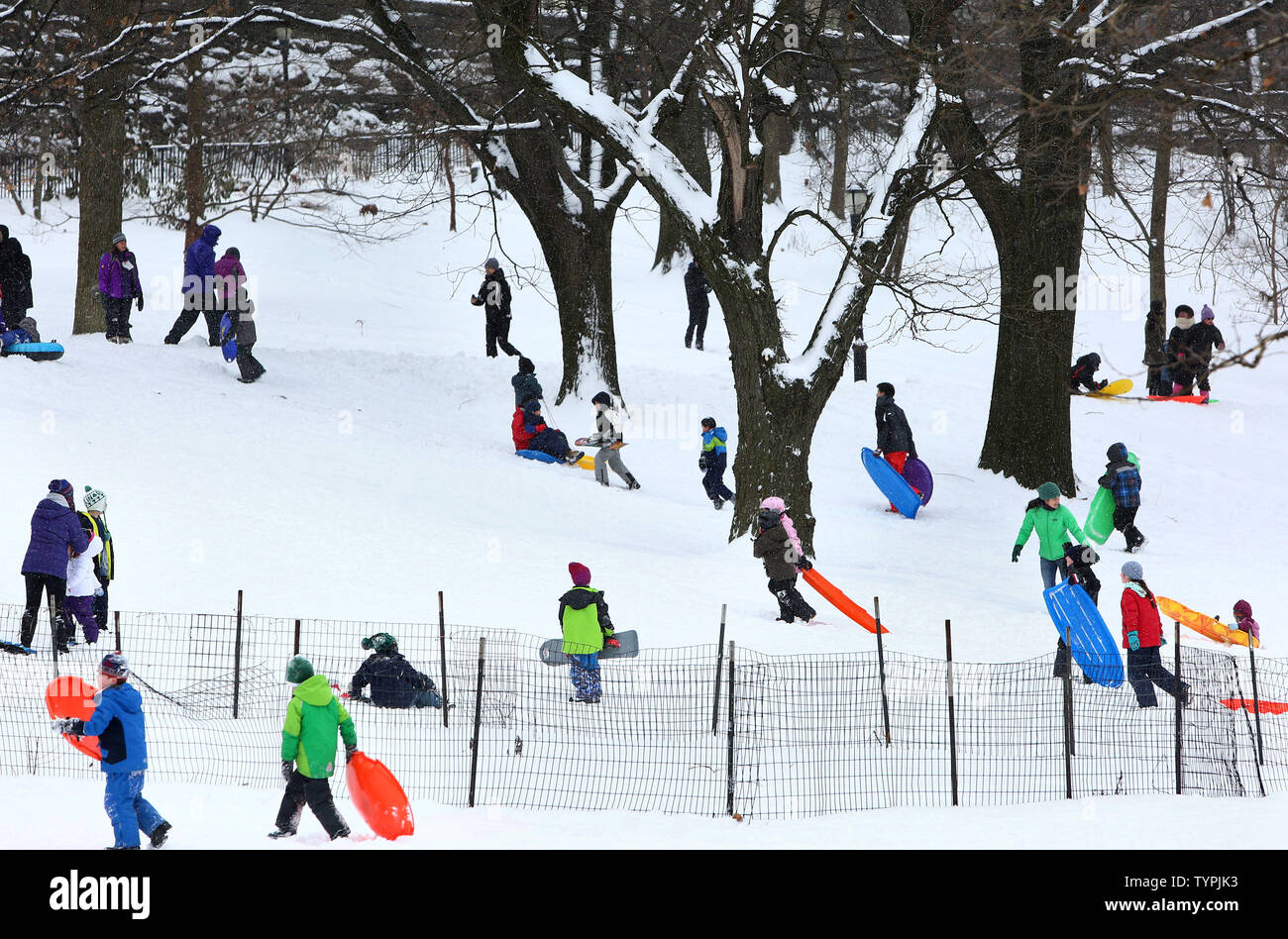 Children enjoy sledding in Riverside Park as they take advantage of a ...