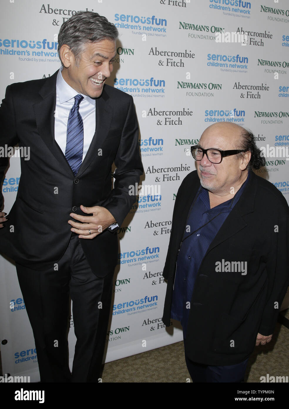 George Clooney and Danny DeVito arrive on the red carpet at the SeriousFun  Children's Network \, image size:984x1390