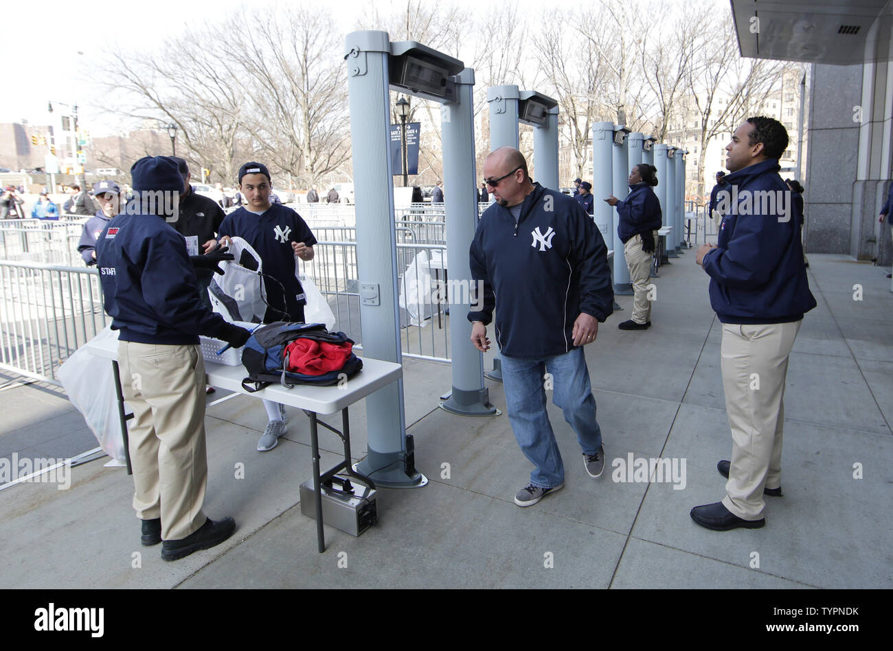 Fans have there bags checked before walking through metal detecters upon  entering the stadium at the opening series of the 2015 MLB Season where the  New York Yankees will play the Toronto