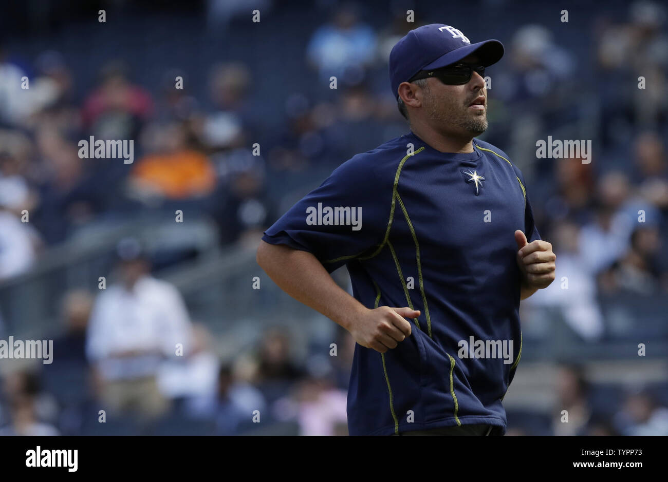 Tampa Bay Rays manager jogs back to the dug out after changing pitchers