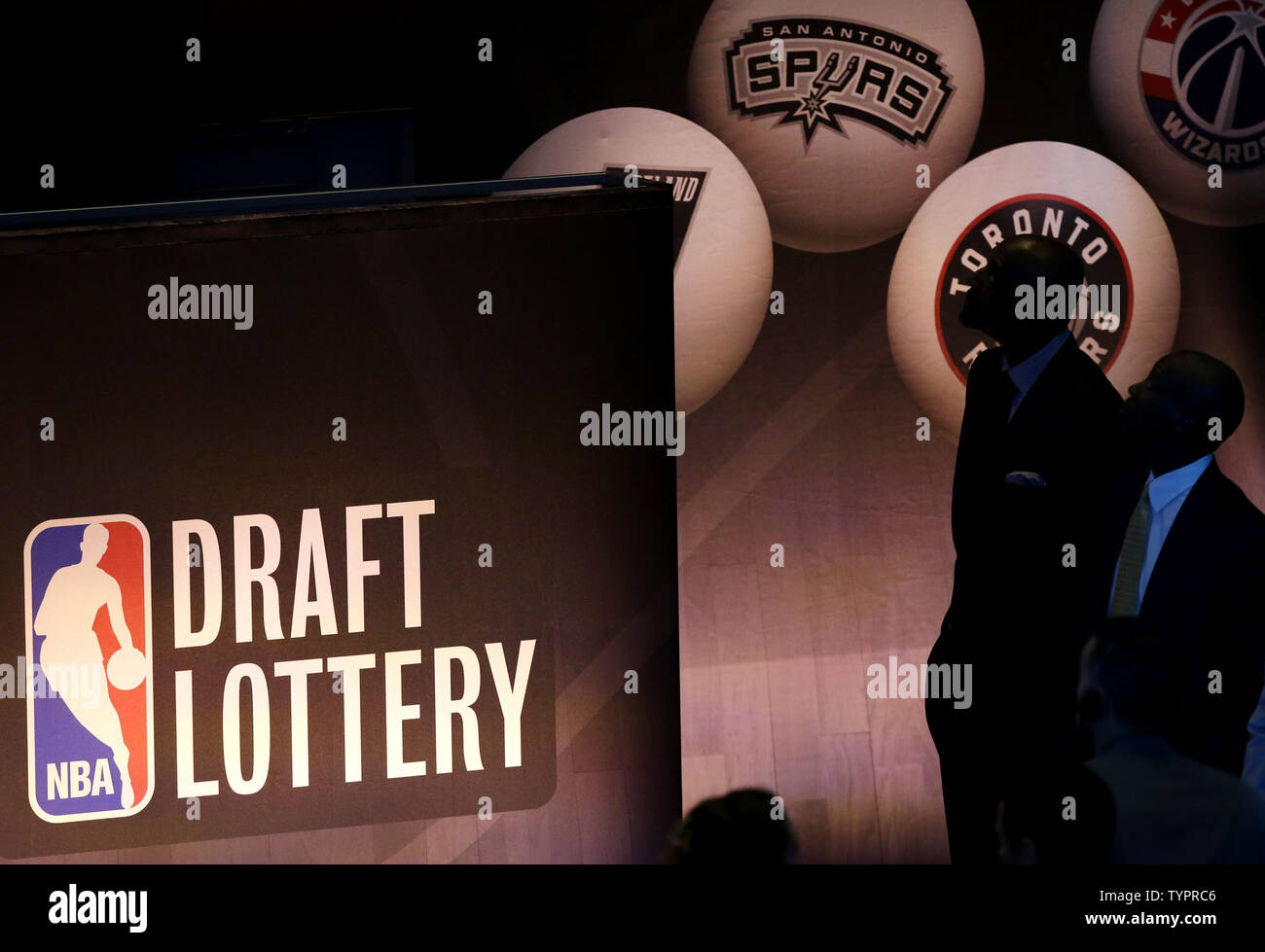 Team representatives wait for the start of the 2015 NBA Draft Lottery at  the New York Hilton Midtown in New York City on May 19, 2015. The NBA  employs a weighted lottery