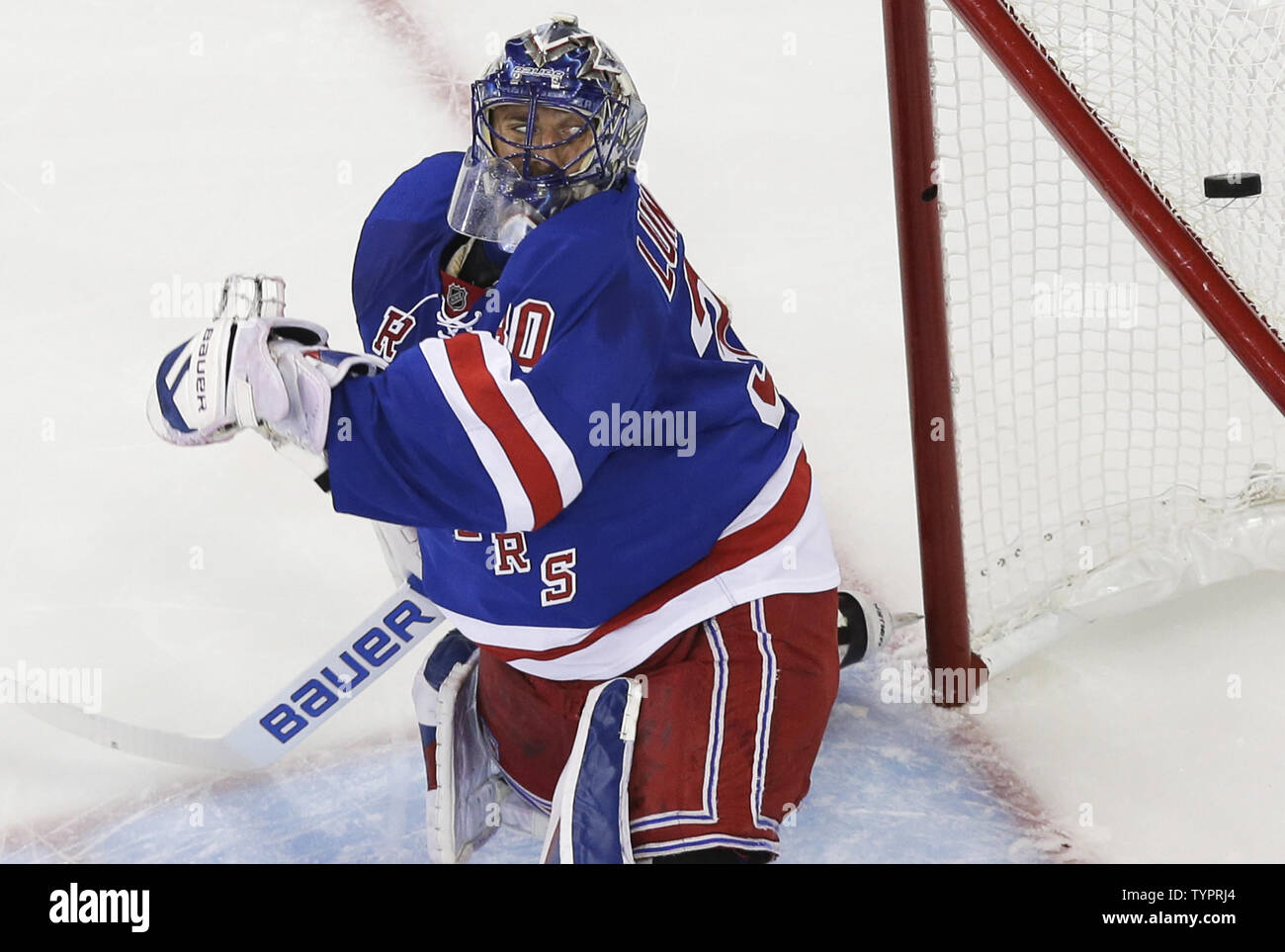 New York Rangers Henrik Lundqvist watches the puck go just over the ...