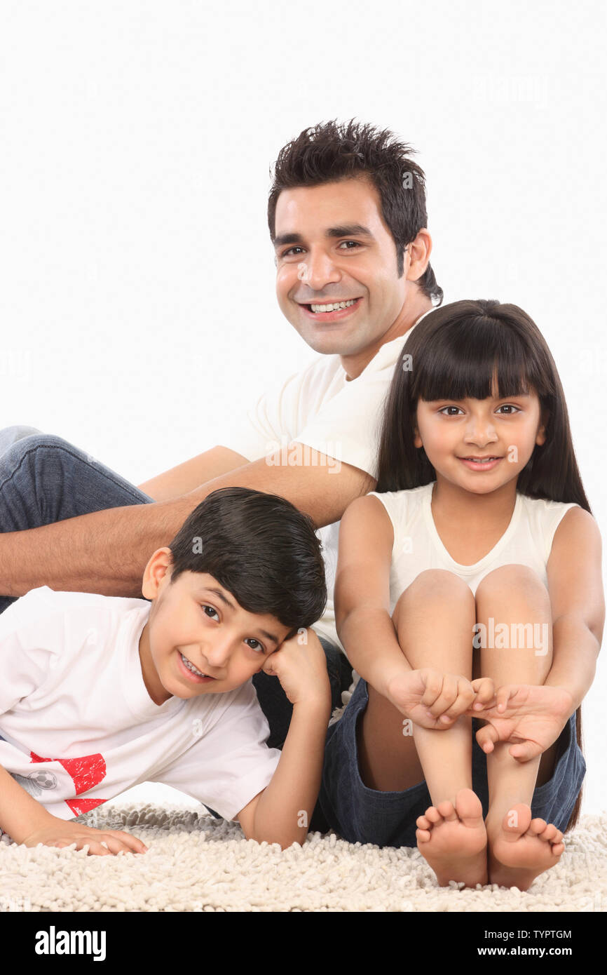 Portrait of an Indian family smiling Stock Photo Alamy