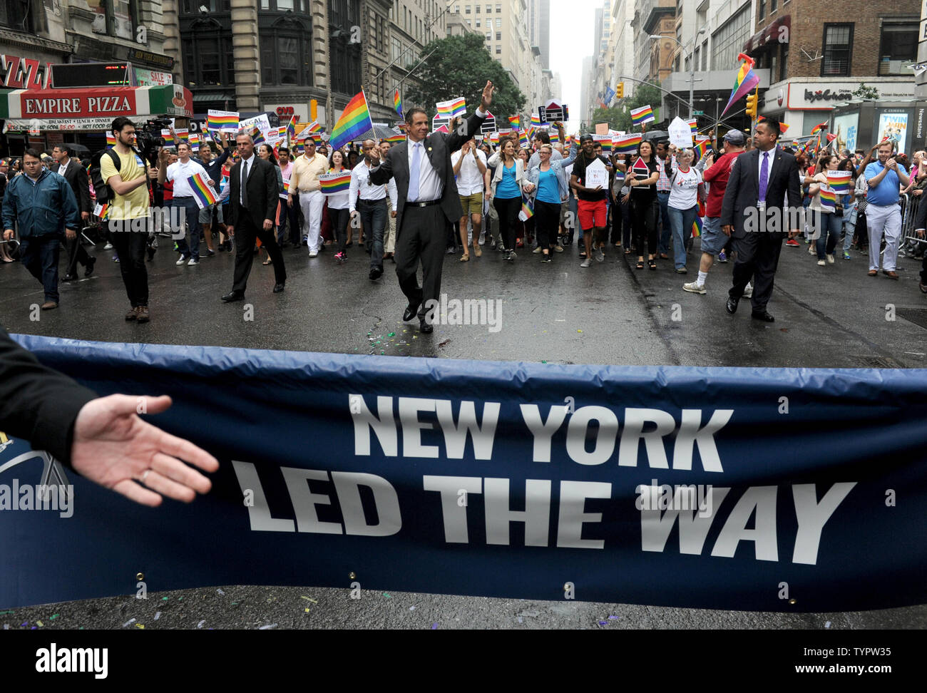 New York Governor Andrew M. Cuomo marches carrying a rainbow flag at the 2015 NYC Gay Pride March in New York City on June 28, 2015. The parade comes 2 days after the US Supreme Court rules gay marriage is legal nationwide The ruling, which sparked celebrations outside the court in Washington DC, brings to an end more than a decade of bitter legal battles.       Photo by Dennis Van Tine/UPI Stock Photo