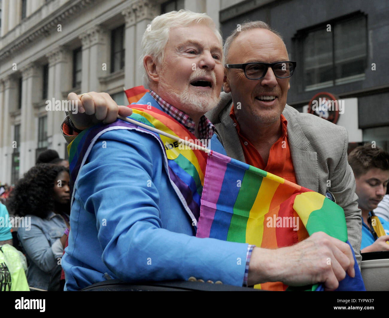 Sir Derek Jacobi and husband Richard Clifford marche carrying a rainbow flag at the 2015 NYC Gay Pride March in New York City on June 28, 2015. The parade comes 2 days after the US Supreme Court rules gay marriage is legal nationwide The ruling, which sparked celebrations outside the court in Washington DC, brings to an end more than a decade of bitter legal battles.       Photo by Dennis Van Tine/UPI Stock Photo