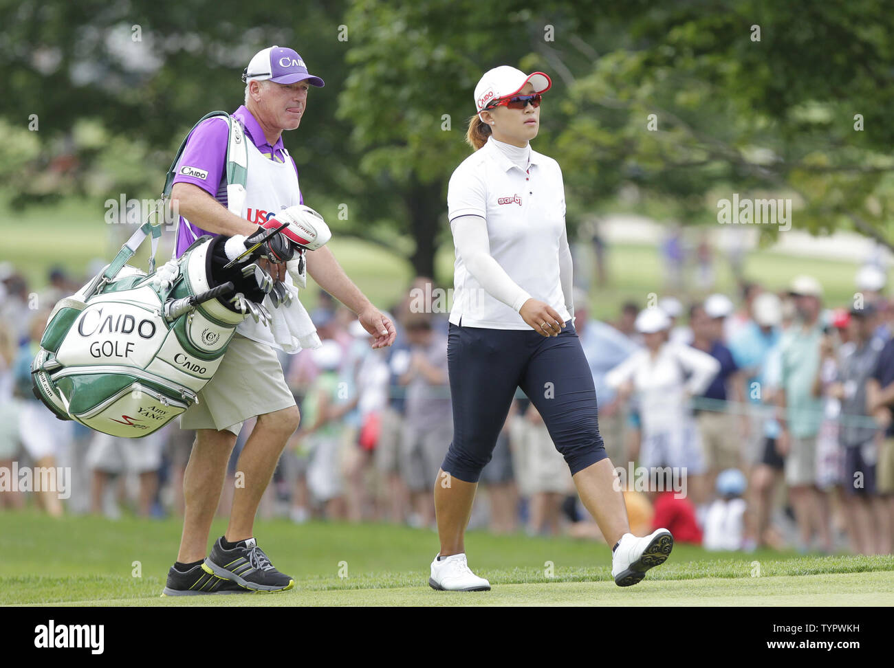 Amy Yang of Korea and caddie Greg Johnston walk to the first green in the final round of the LPGA U.S. Women's Open Championship at Lancaster Country Club in Lancaster, PA on July 12, 2015.       Photo by John Angelillo/UPI Stock Photo