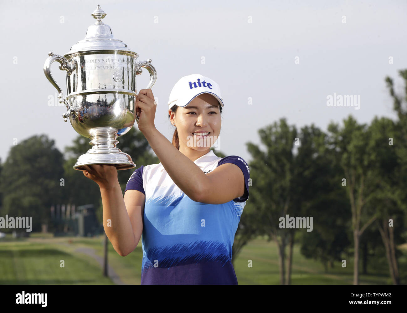 In Gee Chun of Korea holds up the championship trophy on the 18th green in the final round of the LPGA U.S. Women's Open Championship at Lancaster Country Club in Lancaster, PA on July 12, 2015. Chun wins the U.S. Women's Open and her first LPGA major championship with a score of 8 under par.     Photo by John Angelillo/UPI Stock Photo