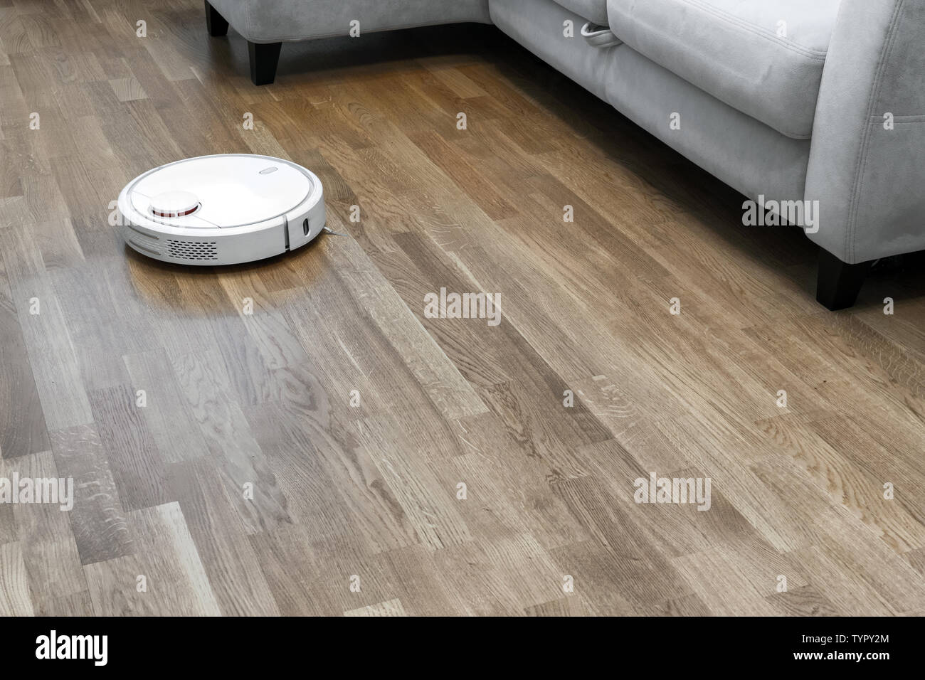Robot Vacuum Cleaner Runs On Wood Parquet Floor Modern Smart