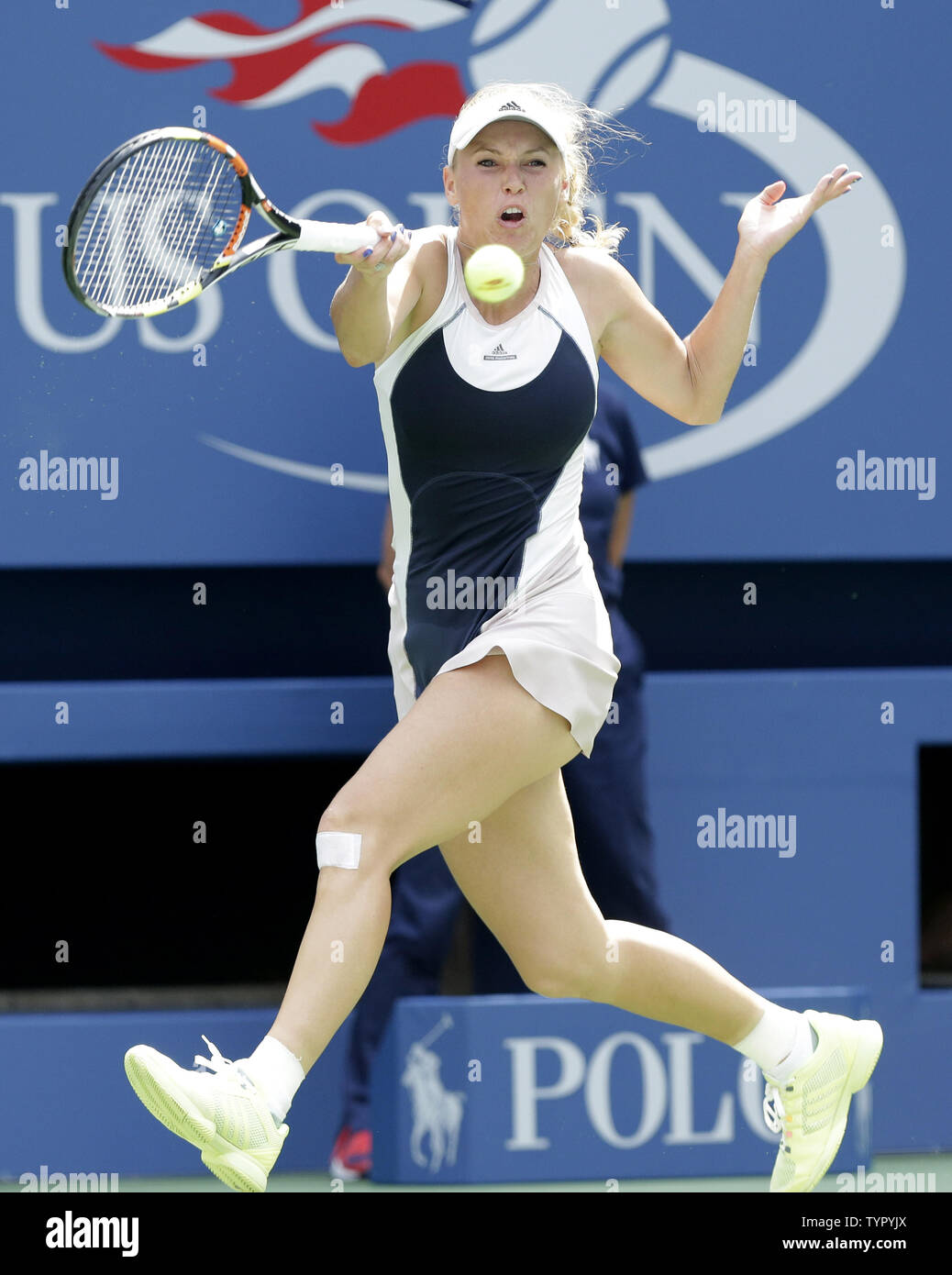 Caroline Wozniacki of Denmark hits a forehand to Jamie Loeb in their first round match in Arthur Ashe Stadium on day two at the US Open Tennis Championships at the USTA Billie Jean King National Tennis Center in New York City on September 1, 2015.      Photo by John Angelillo/UPI Stock Photo
