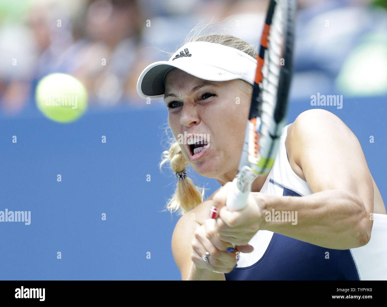 Caroline Wozniacki of Denmark hits a backhand to Jamie Loeb in their first round match in Arthur Ashe Stadium on day two at the US Open Tennis Championships at the USTA Billie Jean King National Tennis Center in New York City on September 1, 2015.      Photo by John Angelillo/UPI Stock Photo