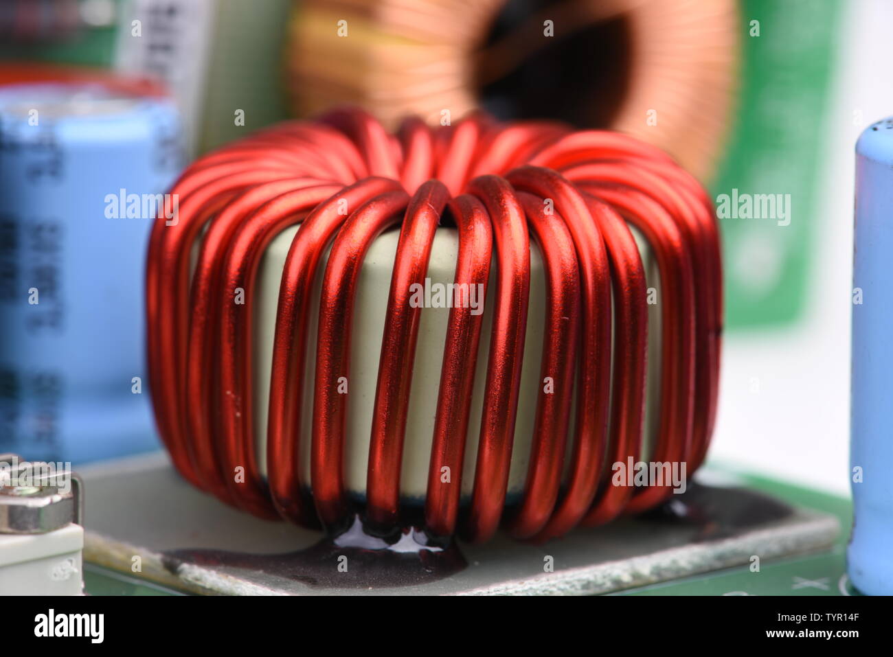 Copper coil, inductor on circuit board with blurred background Stock Photo Alamy