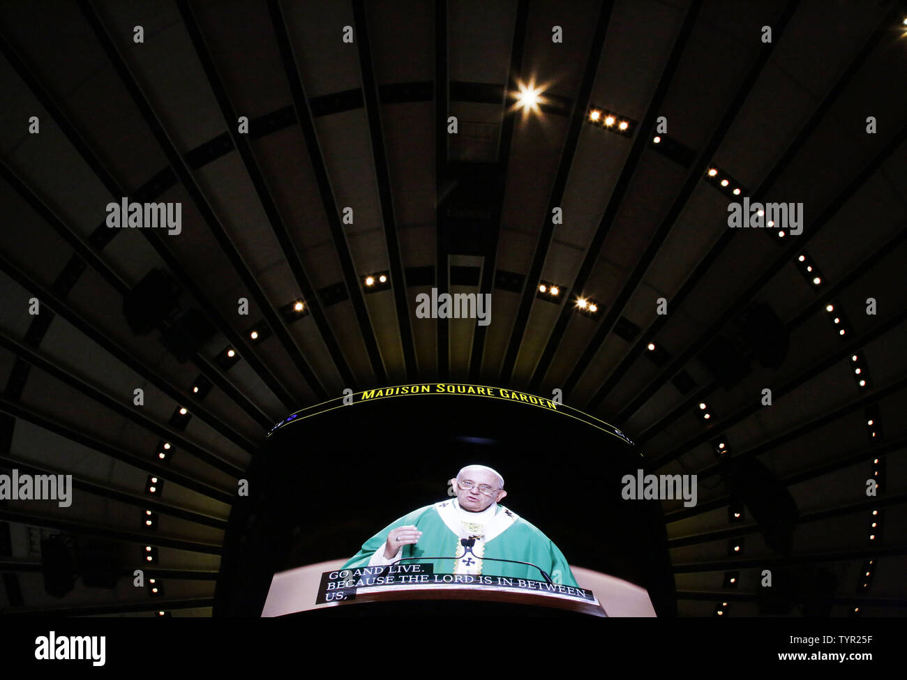 The Ceiling Holds A Monitor That Shows Pope Francis As He