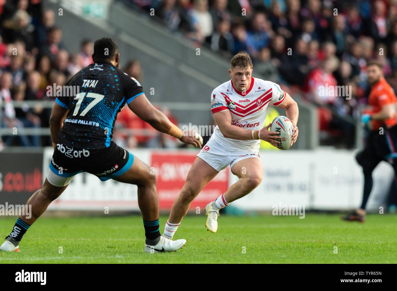 14h June 2019 , Totally Wicked Stadium, St Helens, England;  Betfred Super League, Round 18, St Helens vs Huddersfield Giants, Morgan Knowles of St Helens looks for a way around Ukuma Ta’ai (17) of Huddersfield Giants  Credit: Richard Long/News Images Stock Photo