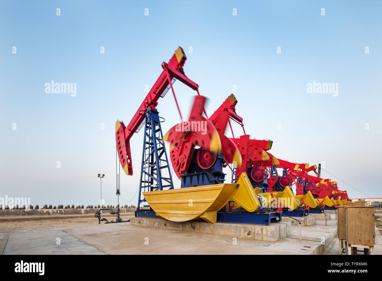 landscape of oilfield with pump units in blue sky Stock Photo - Alamy