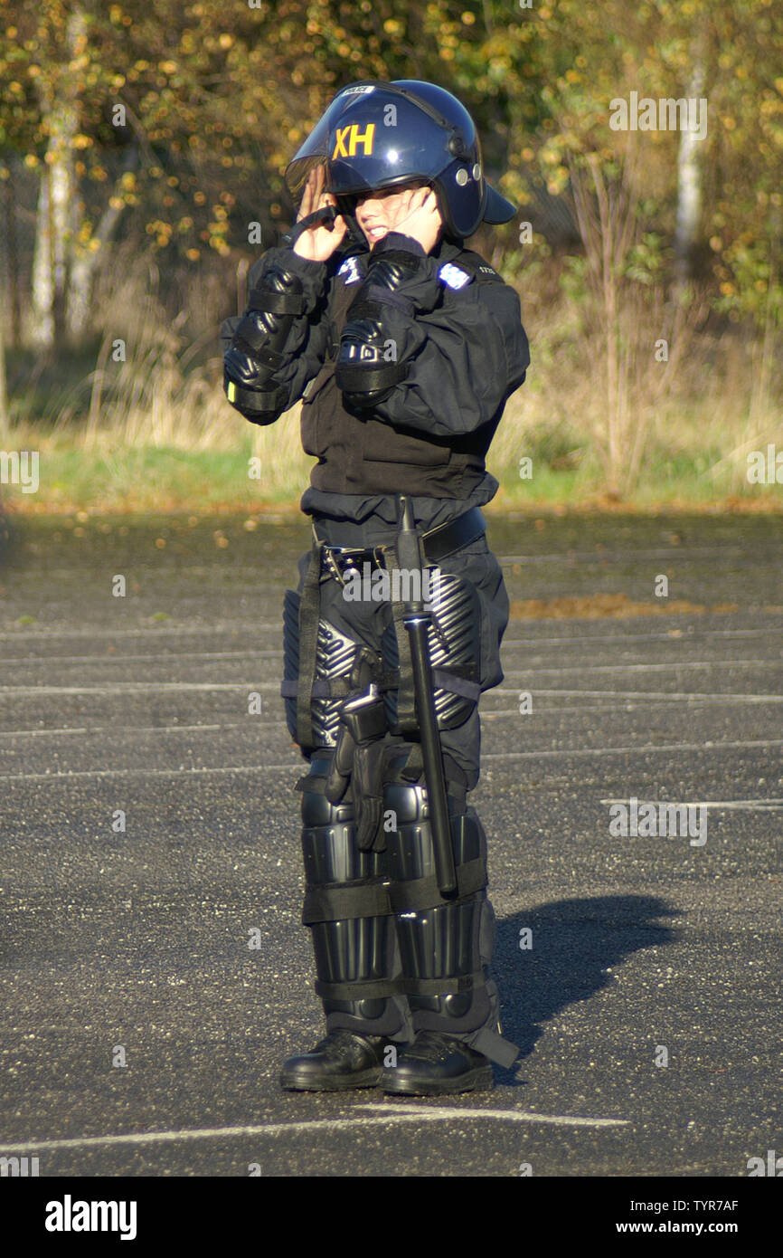 police woman in full riot protection equipment Stock Photo - Alamy