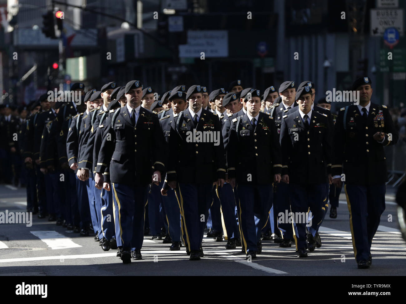 Men in uniform march on the parade route at the St. Patrick's Day ...