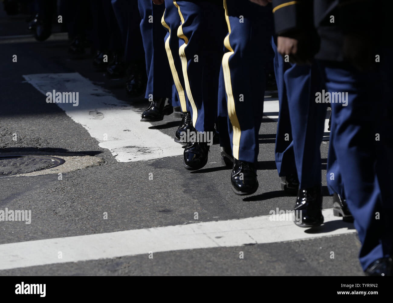 Men in uniform march on the parade route at the St. Patrick's Day ...