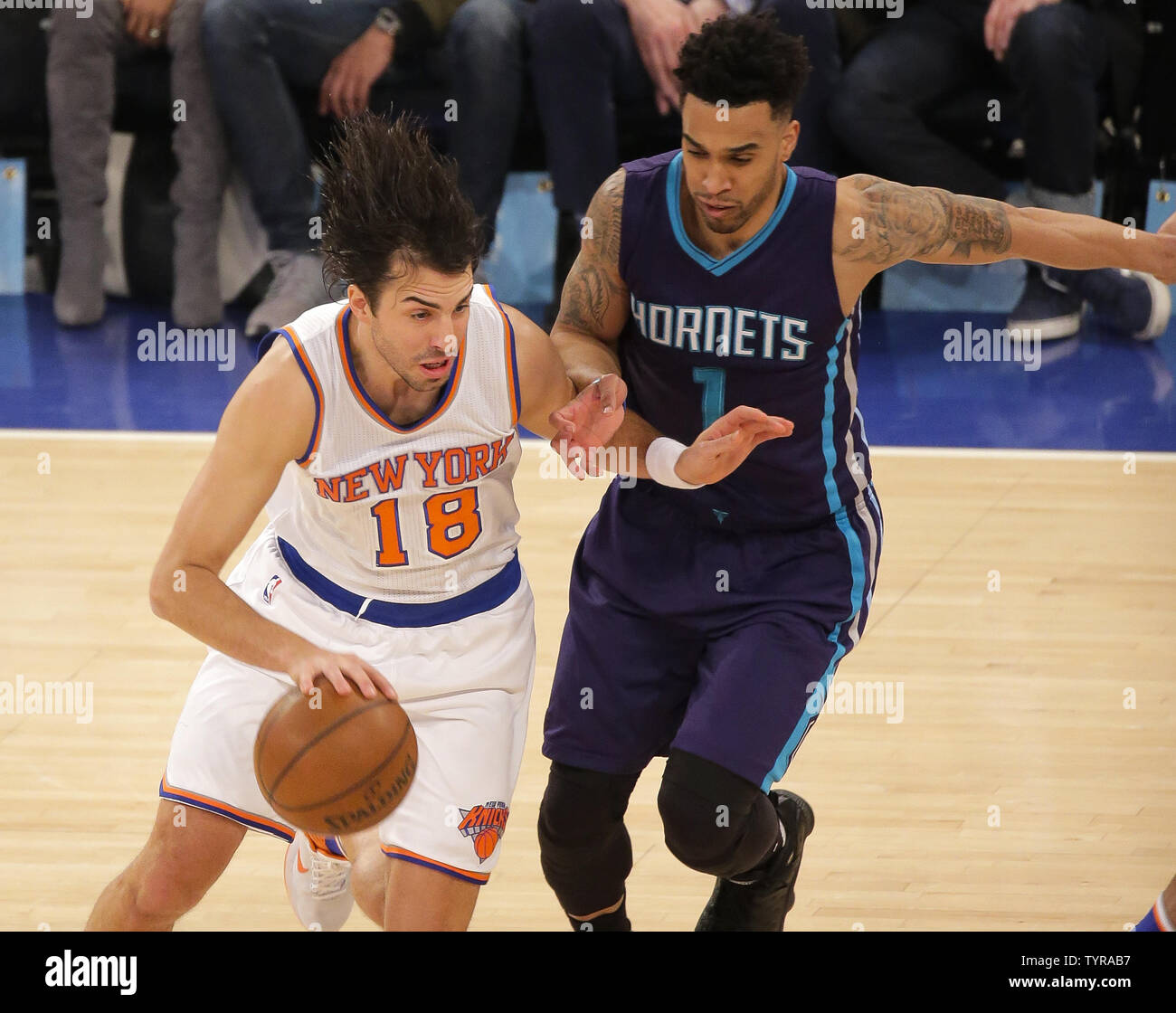 New York Knicks guard Sasha Vujacic (18) makes his move around Charlotte Hornets guard Courtney Lee (1) in the first quarter at Madison Square Garden in New York City on April 6, 2016.    Photo by Ray Stubblebine/UPI Stock Photo