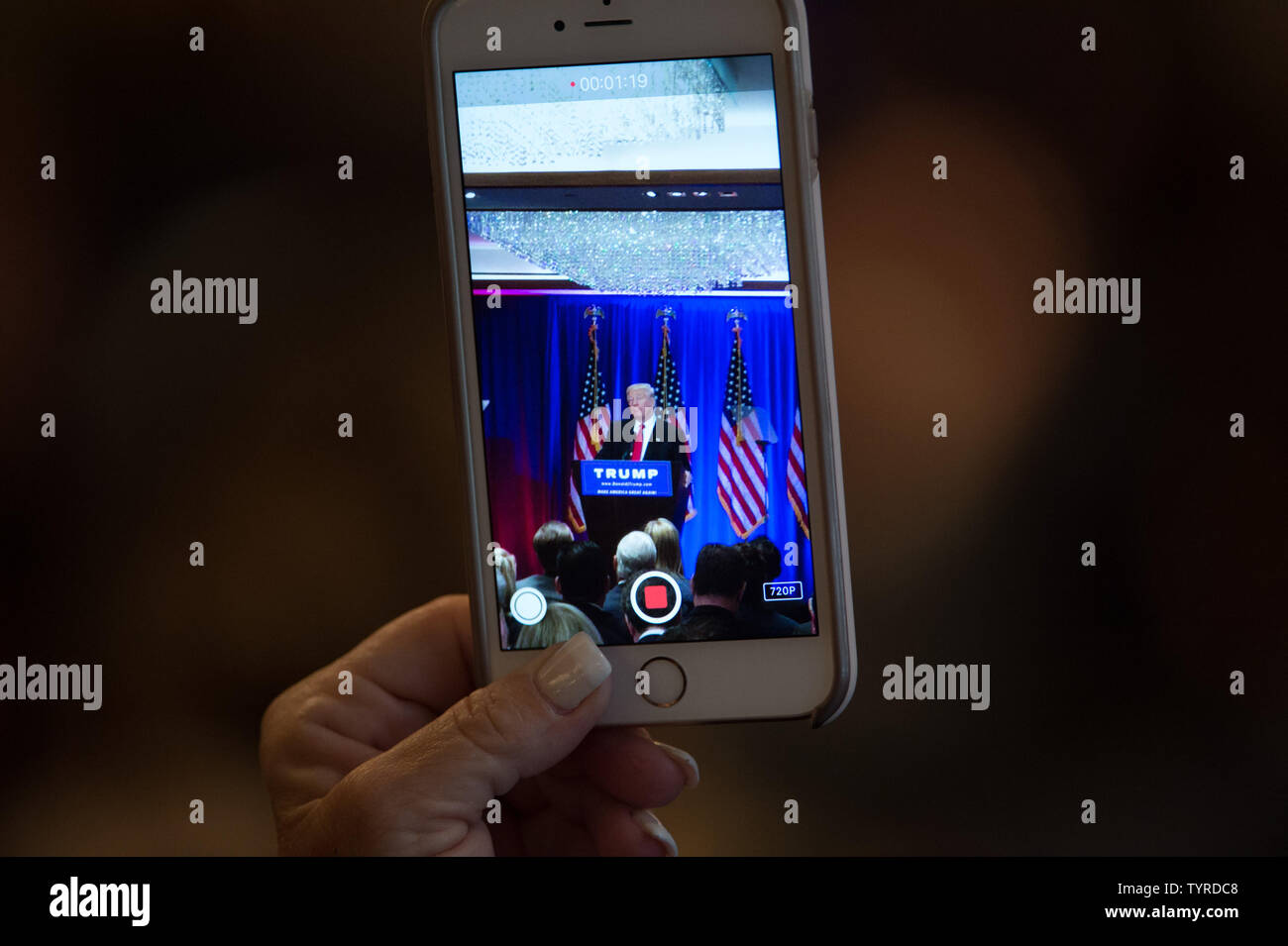 A supporter records Republican candidate for President Donald Trump speaks at Trump Soho Hotel, June 22, 2016 in New York City.   Photo by Bryan R. Smith/UPI Stock Photo