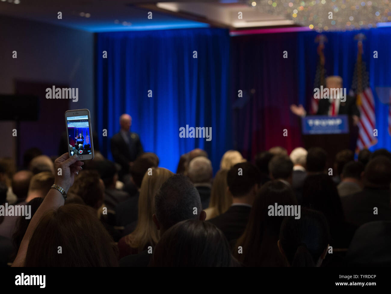 A supporter records Republican candidate for President Donald Trump during his speech at Trump Soho Hotel, June 22, 2016 in New York City.     Photo by Bryan R. Smith/UPI Stock Photo