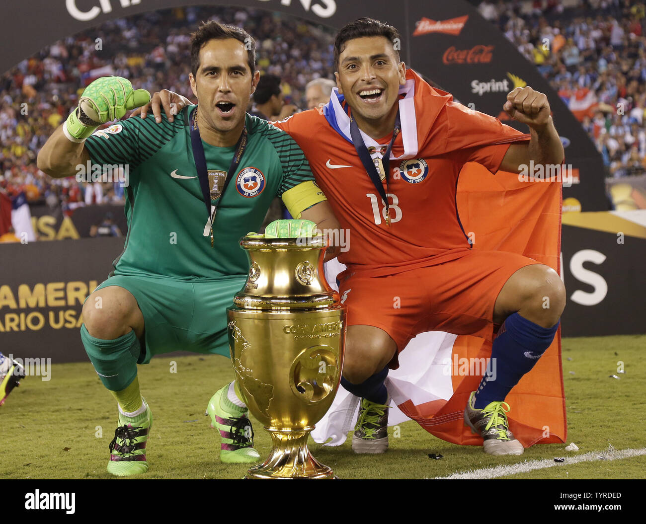 Claudio Bravo and Gonzalo Jara of Chile celebrate on the field after there team defeats Argentina at the Copa America Centenario USA 2016 Finals at MetLife Stadium in East Rutherford, New Jersey on June 26, 2016. Chile defeated Argentina 4-2 in penalty kicks and won there second consecutive Copa America.     Photo by John Angelillo/UPI Stock Photo