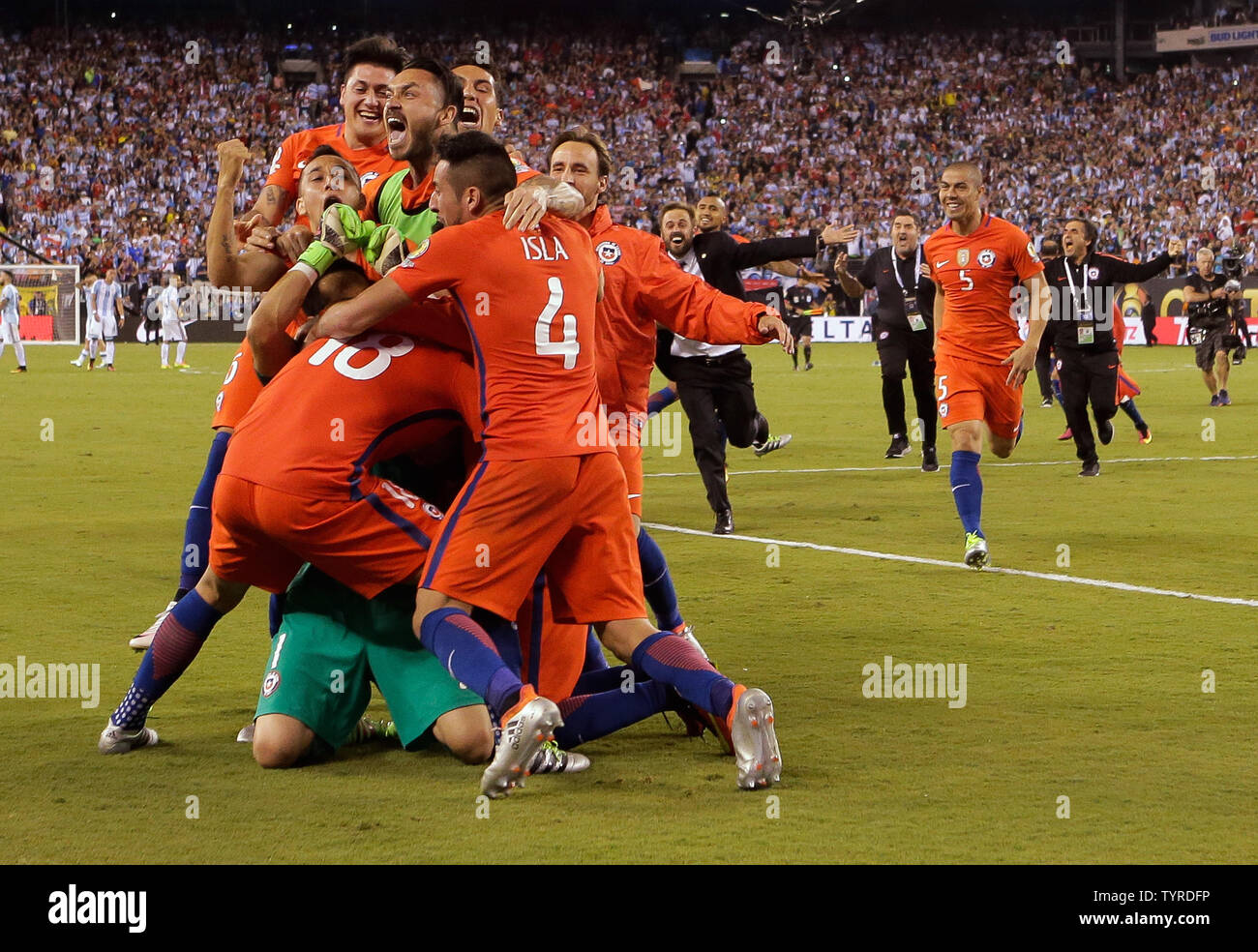 Chile celebrates on top of goalie Chile goalkeeper Claudio Bravo after beating Argentina in the penalty kicks phase at the Copa America Centenario USA 2016 Finals at MetLife Stadium in East Rutherford, New Jersey on June 26, 2016.      Photo by Ray Stubblebine/UPI Stock Photo