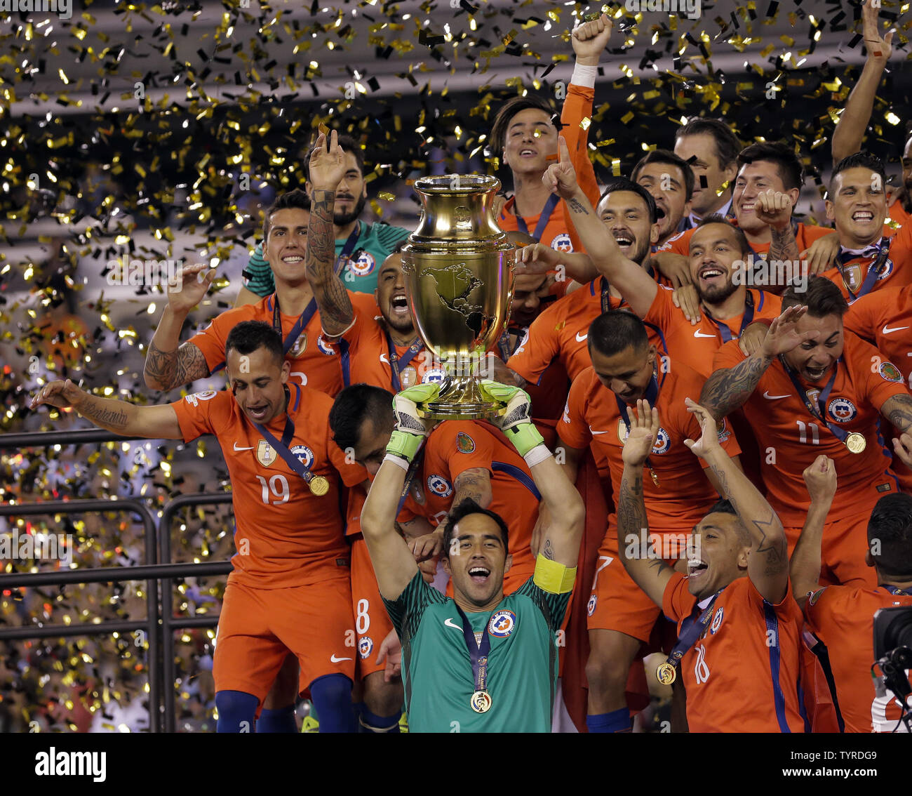 Chile goalkeeper Claudio Bravo (1) holds the cup as his teammates celebrate after beating Argentina in the penalty kicks phase at the Copa America Centenario USA 2016 Finals at MetLife Stadium in East Rutherford, New Jersey on June 26, 2016.      Photo by Ray Stubblebine/UPI Stock Photo