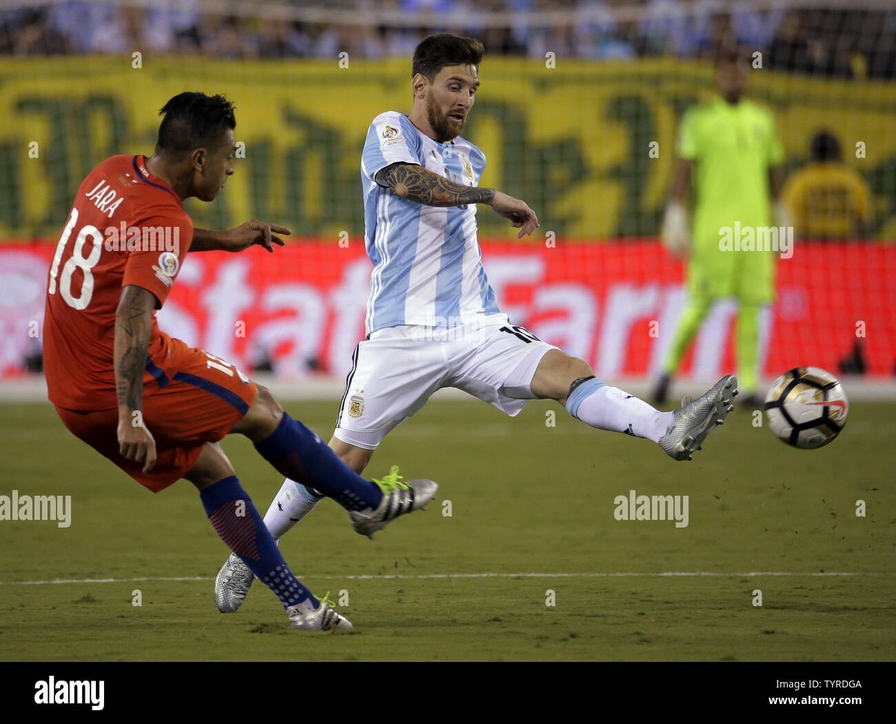 Argentina midfielder Lionel Messi (10) passes the ball around Chile defender Gonzalo Jara (18) in the second half at the Copa America Centenario USA 2016 Finals at MetLife Stadium in East Rutherford, New Jersey on June 26, 2016.      Photo by Ray Stubblebine/UPI Stock Photo