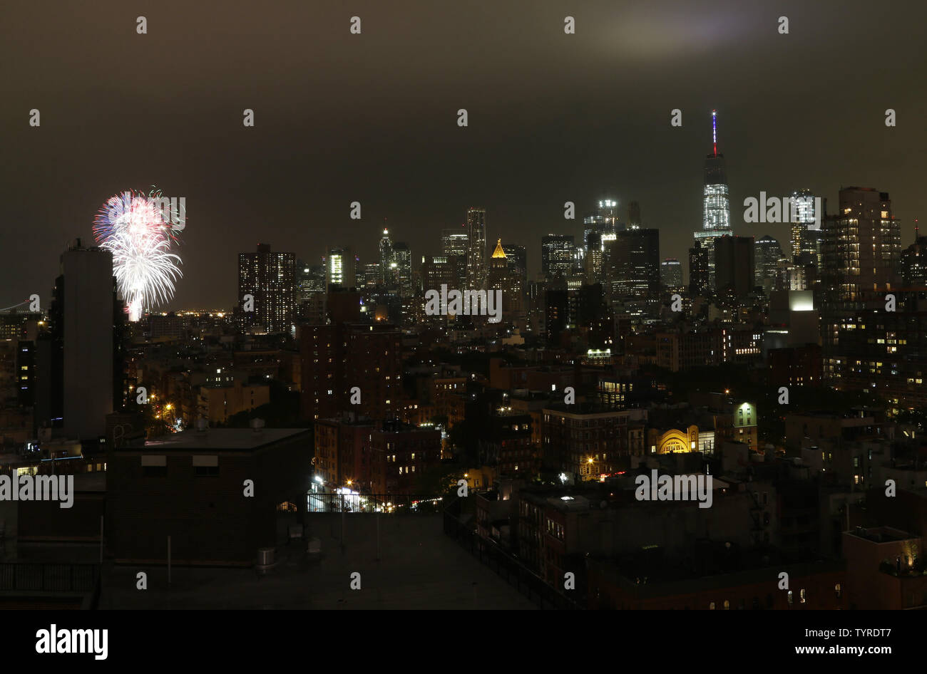 Forth of July fireworks explode over the East River with a view of One ...