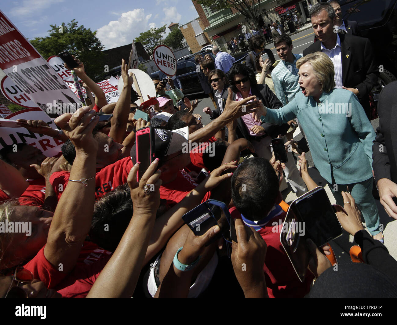 Democratic candidate for President Hillary Clinton greets union members on strike outside of the Trump Taj Mahal Hotel and Casino in Atlantic City, NJ on July 6, 2016. Hillary Clinton also stood by closed down Trump Plaza on the Atlantic City boardwalk and cast Republican rival Donald Trump's turbulent business record in the seaside town as a prime example of why he shouldn't become president. On Tuesday F.B.I. director, James B. Comey recommended no criminal charges against Hillary Clinton for her handling of classified information while she was secretary of state.    Photo by John Angelillo/ Stock Photo