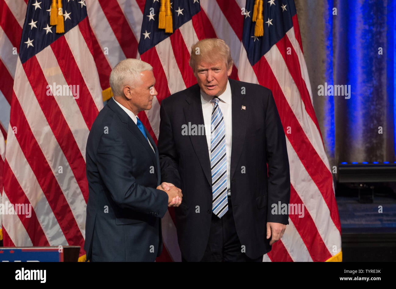 Presumptive Republican nominee for President Donald Trump shakes hands with his pick for Vice President, Mike Pence, left, at a press conference at the New York Hilton on July 16, 2016 in New York City. Photo by Bryan R. Smith/UPI Stock Photo