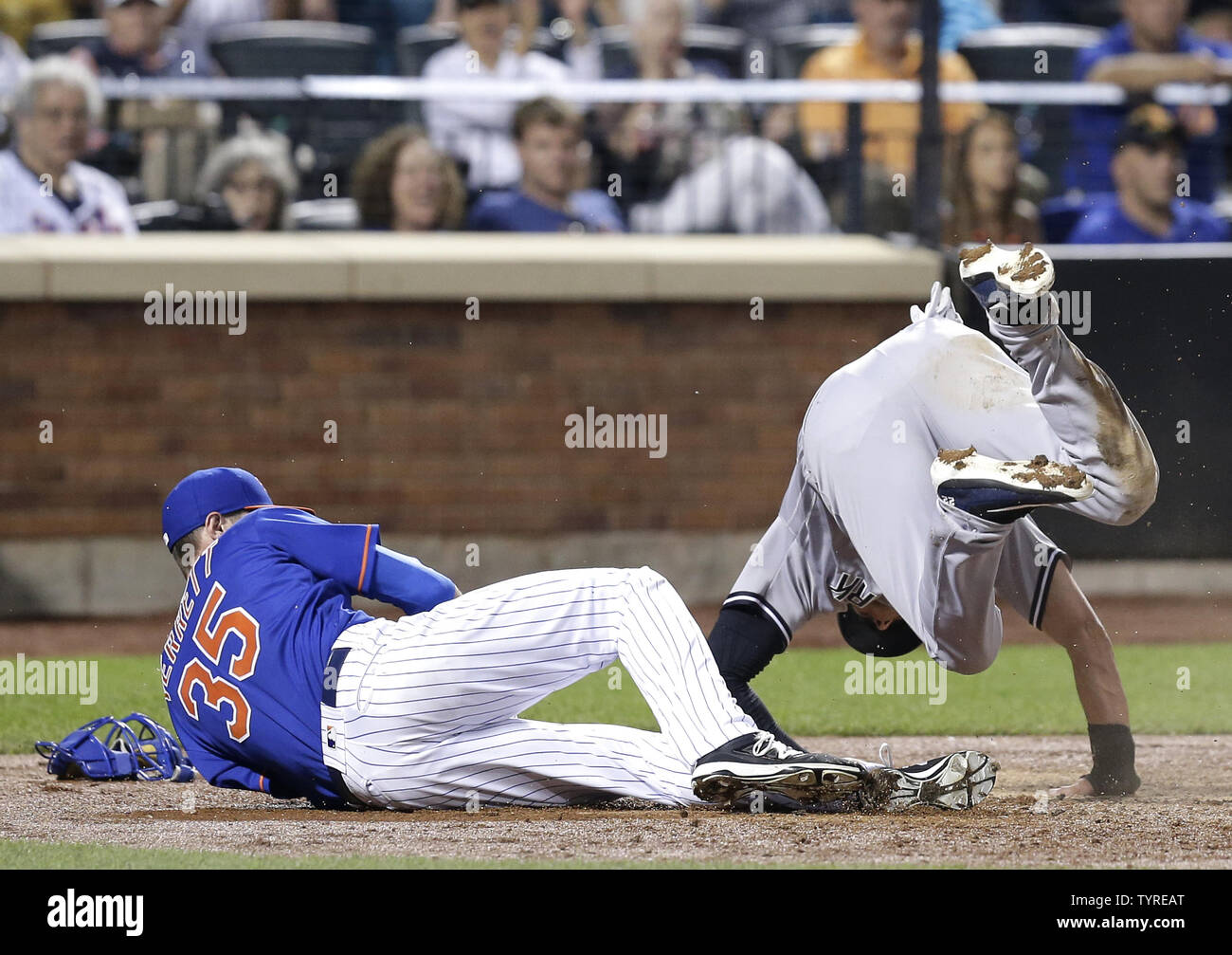 New York Yankees Jacoby Ellsbury collides with New York Mets starting pitcher Logan Verrett at home plate after a wild pitch scores the run at Citi Field in New York City on August 1, 2016.      Photo by John Angelillo/UPI Stock Photo